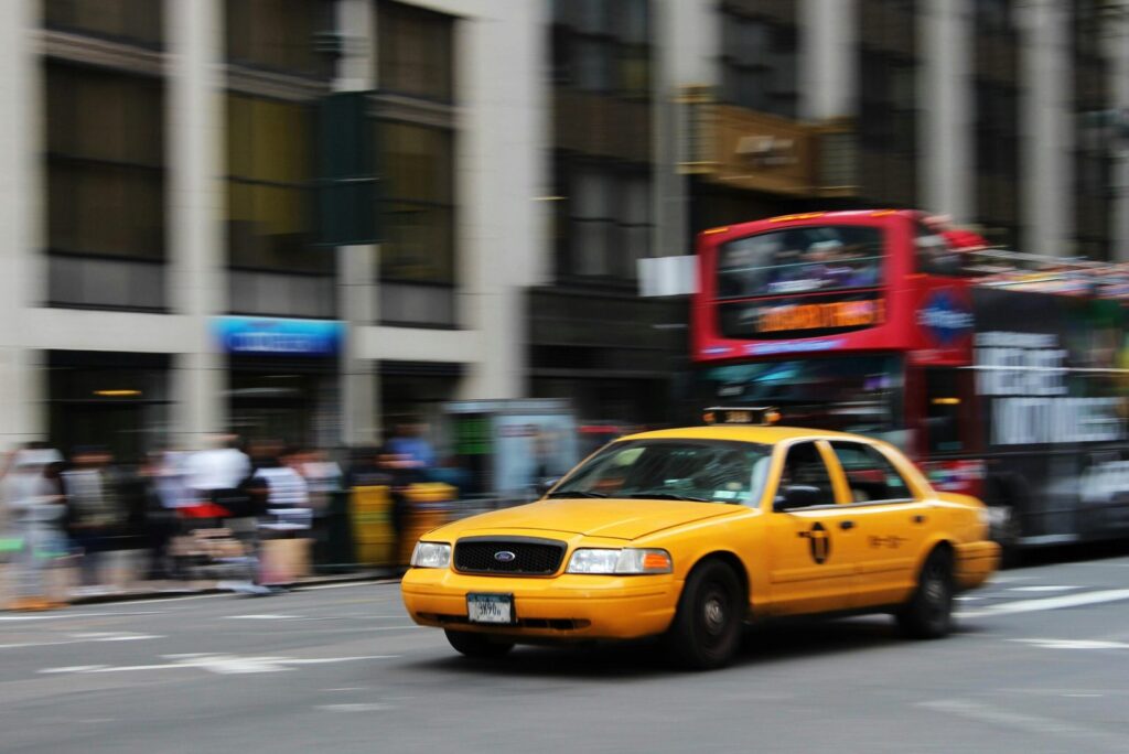 selective focus photography of yellow sedan stockpack pexels scaled 1